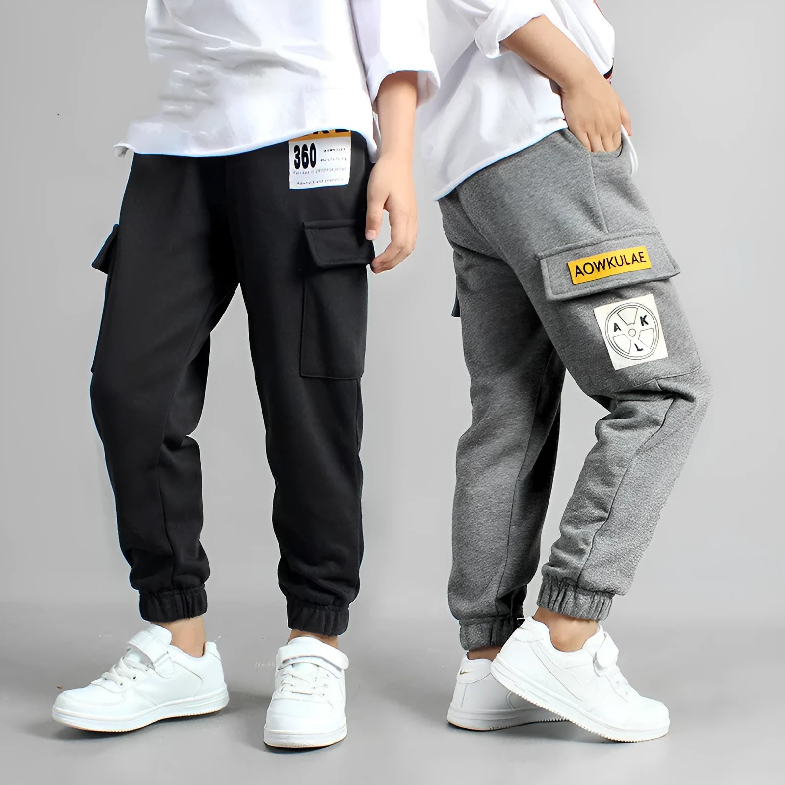Boys' cotton track pants in black size 120cm on a child model