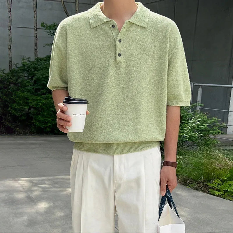 A man's caramel coloured retro knitted polo shirt with short sleeves and an asymmetric design detail.
