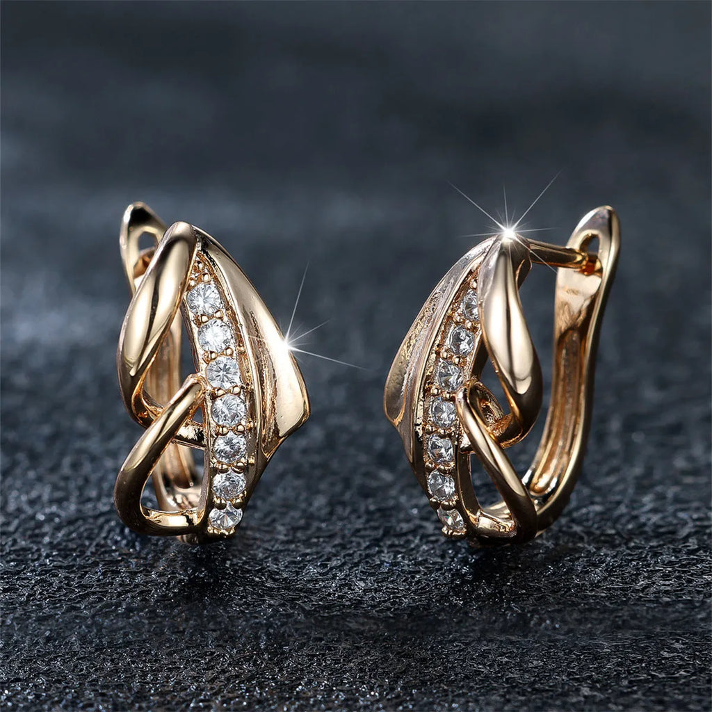 Copper geometric arrow ear clip in champagne gold with white diamond accent