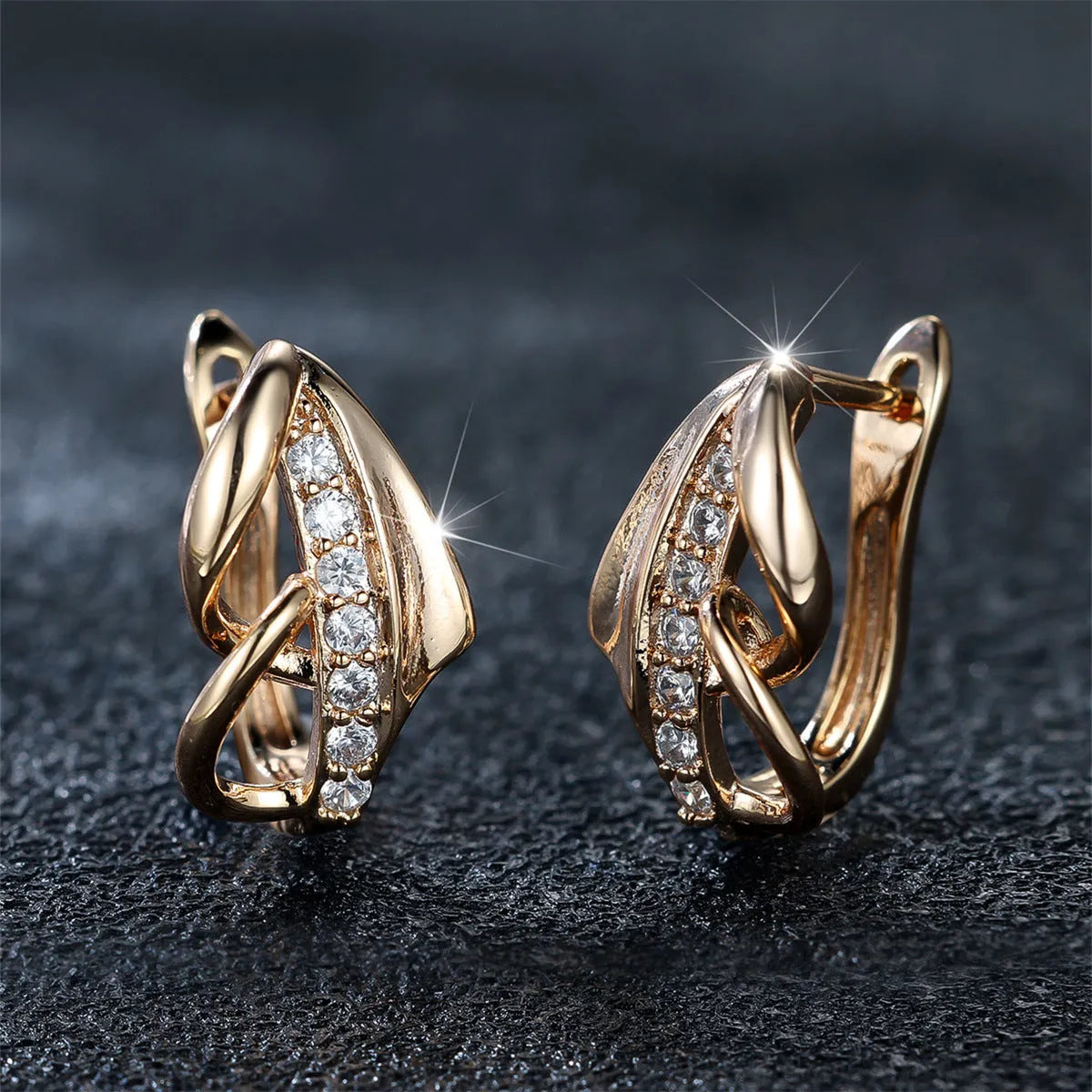 Copper geometric arrow ear clip in champagne gold with white diamond accent