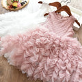 White long-sleeved lace princess dress for girls with an irregular hemline, shown on a hanger.