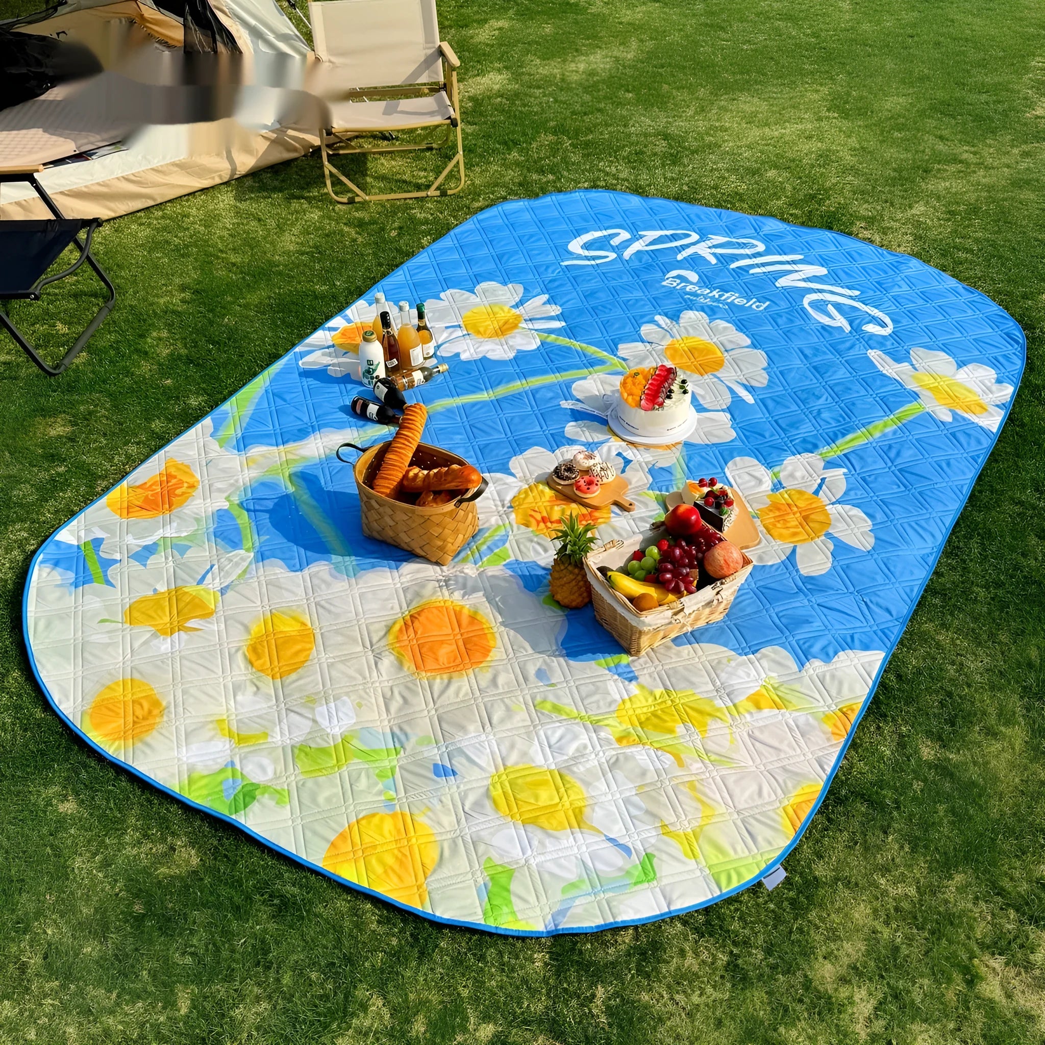 A large waterproof camping mat in a seasonal colour, unrolled on grass, showing its thickened texture.