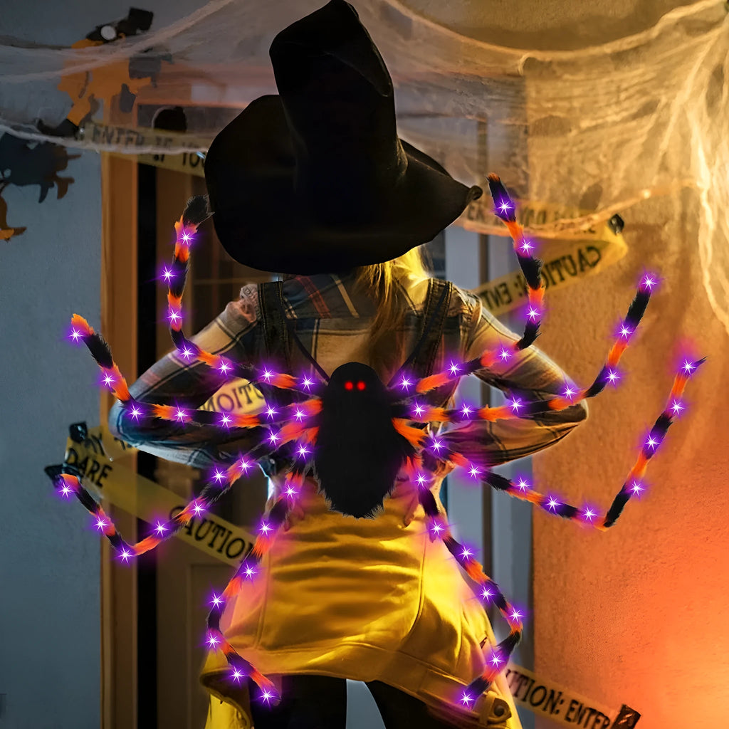 Orange Halloween spider backpack with glowing LED lights on a model, showing plush fabric.