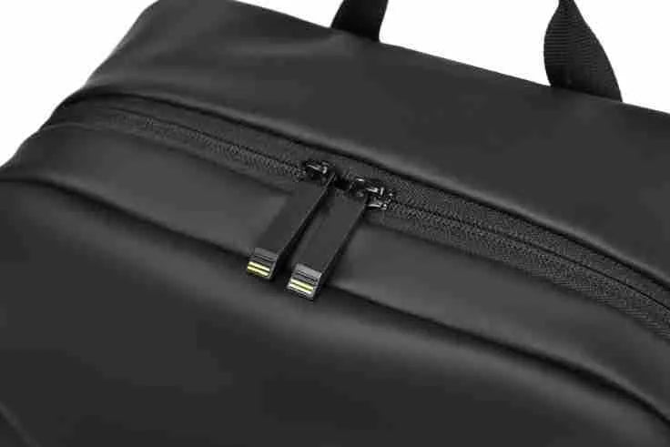 Waterproof PU leather backpack with laptop compartment in black, blue, and grey colour options
