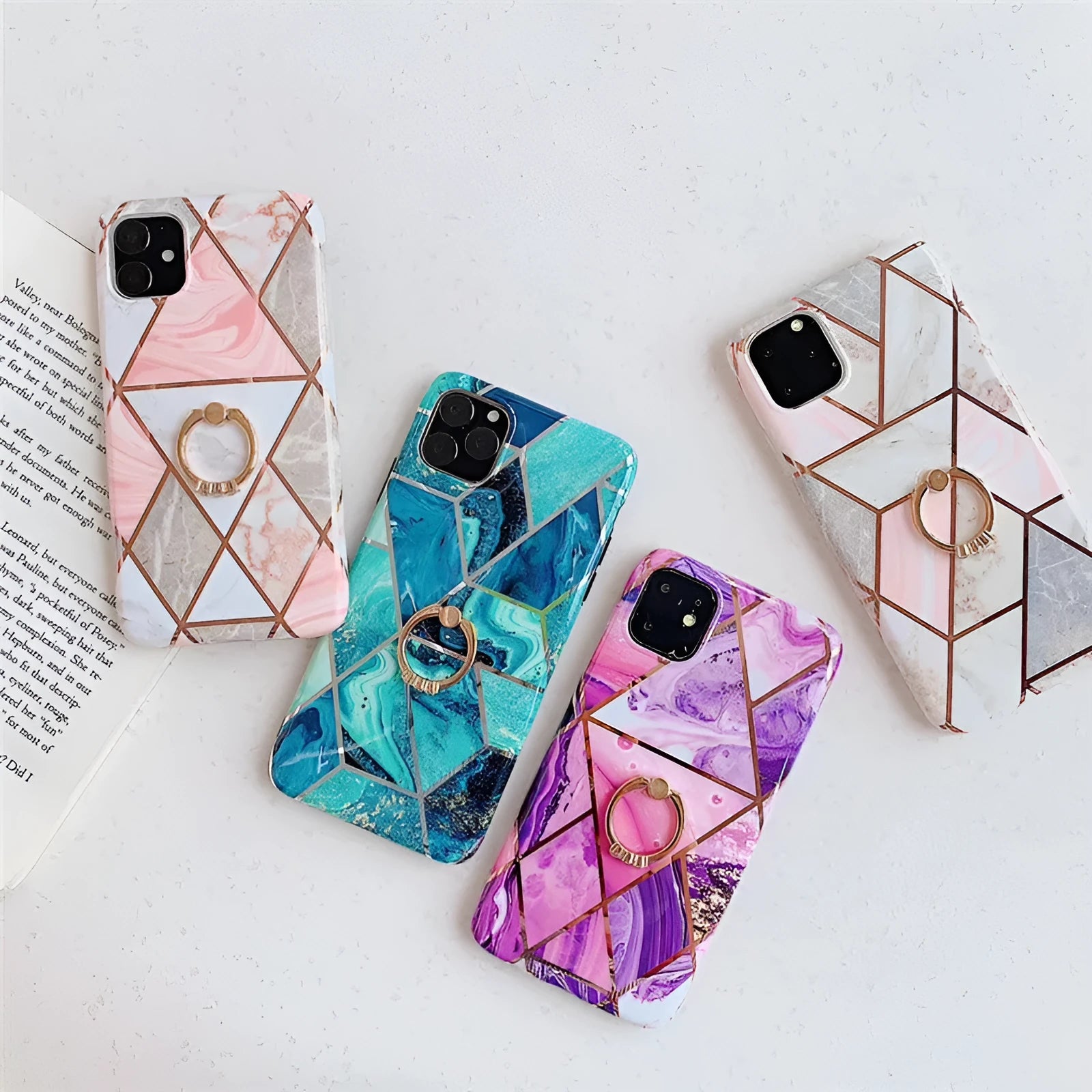 Geometric patterned purple TPU iPhone case with a silver metal bracket ring attached to the back.