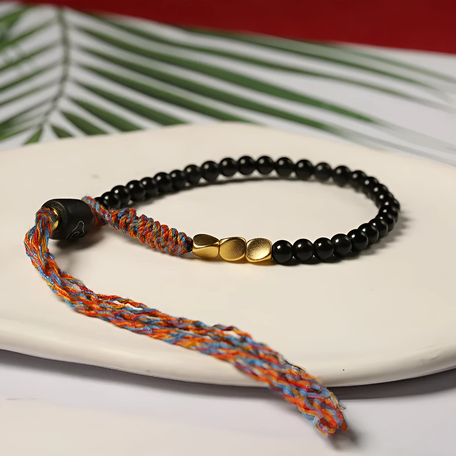 Obsidian coloured hand-woven carrying strap bracelet with 4mm width.