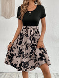 Khaki women's A-line dress with floral print and lace-up detail on the shoulder strap.