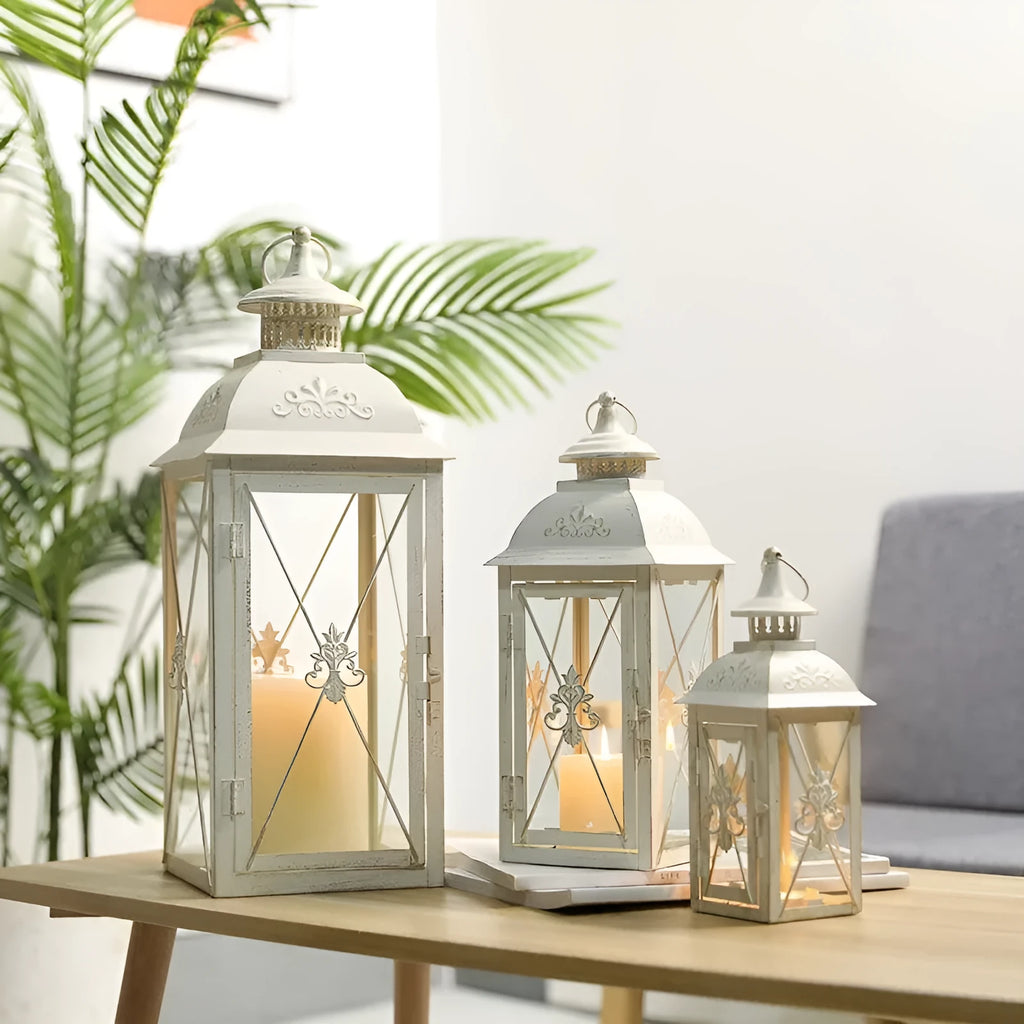 European-style black wrought iron floor-standing storm lantern with tempered glass panels.
