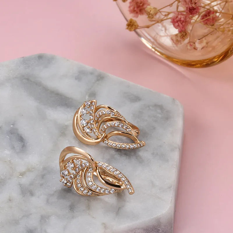 Gold-plated U-shaped ear clasps with wing design featuring micro-inlaid artificial gemstones