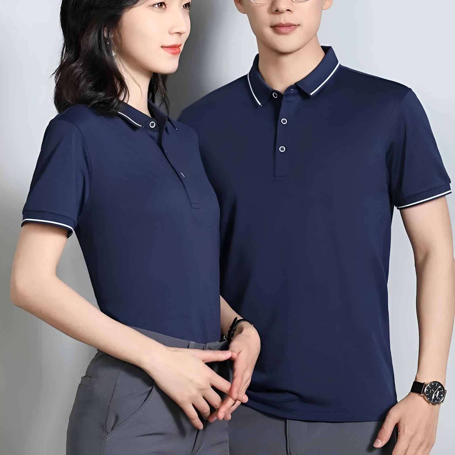 Beautician wearing a short-sleeved asymmetric polo shirt in light blue, showcasing the collar and Cool Silk Cotton fabric.