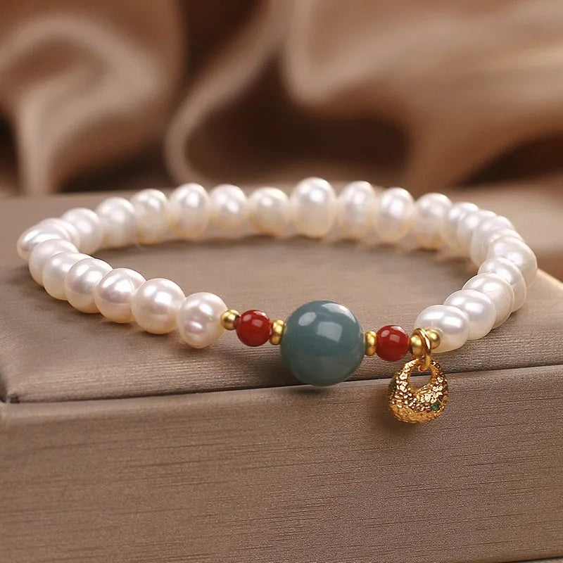 White freshwater pearl and aquamarine bracelet with opal centrepiece, ethnic style