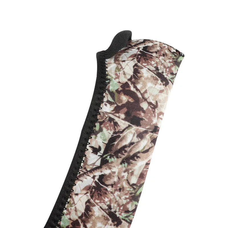 Reversible neoprene scope cover for rifle or shotgun in black and camouflage print lying flat