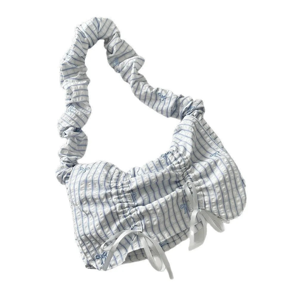 Women's polyester pleated shoulder bag with blue plaid pattern and blue bow detail, clamshell opening