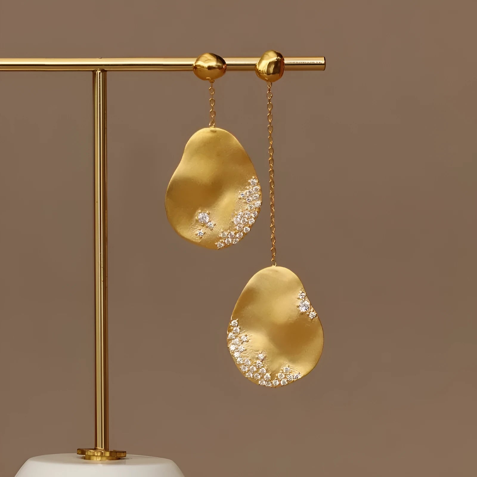 Asymmetric floral earrings with zircon stone centrepiece in gold or silver plating