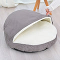 Brown fabric dog kennel with a removable, washable cover for small to medium sized dogs.
