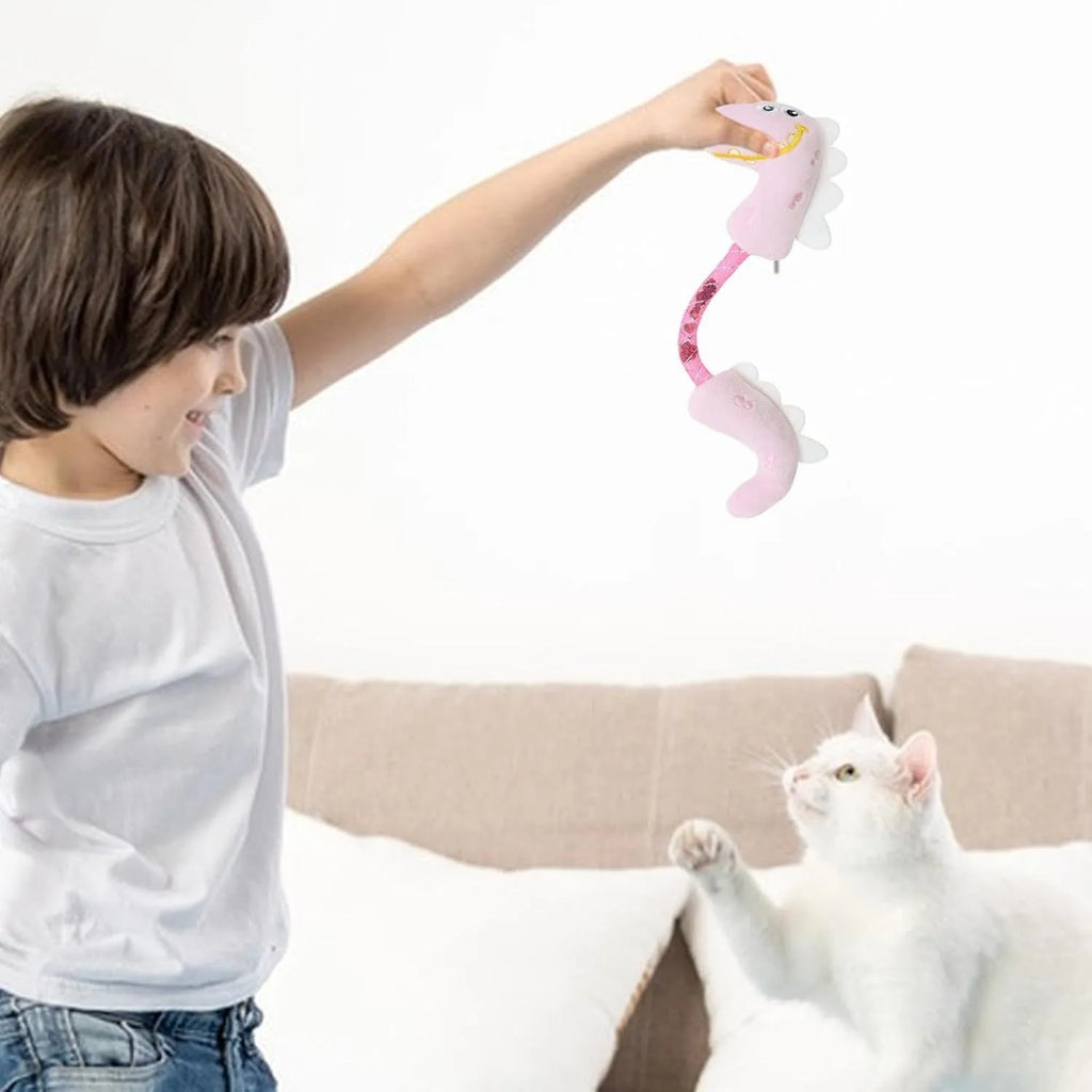 Set of cat toys including plush animals, rope toys, and springs on a pink background