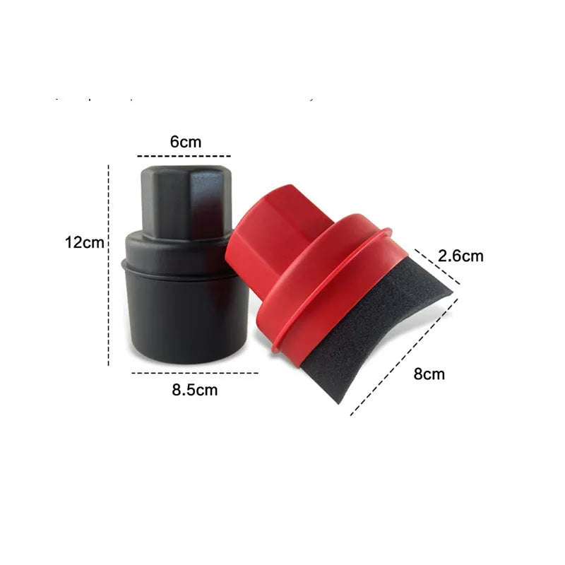 Black and red car tyre polishing sponge brushes with lids on a workbench.