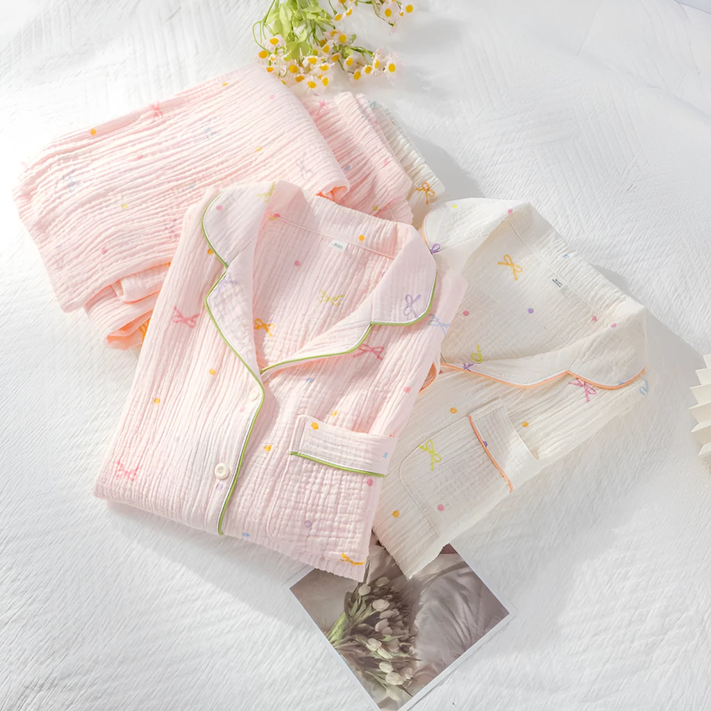 Women's long sleeve cotton pajama set in pink, featuring a crepe cloth top and trousers for homewear.