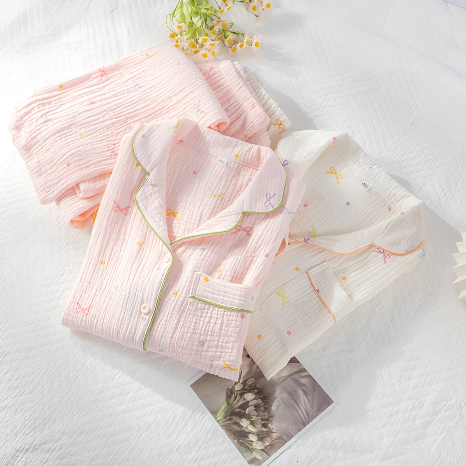 Women's long sleeve cotton pajama set in pink, featuring a crepe cloth top and trousers for homewear.
