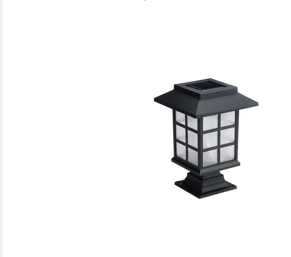 Black solar outdoor LED lawn light with window-style apertures emitting soft white or warm white light