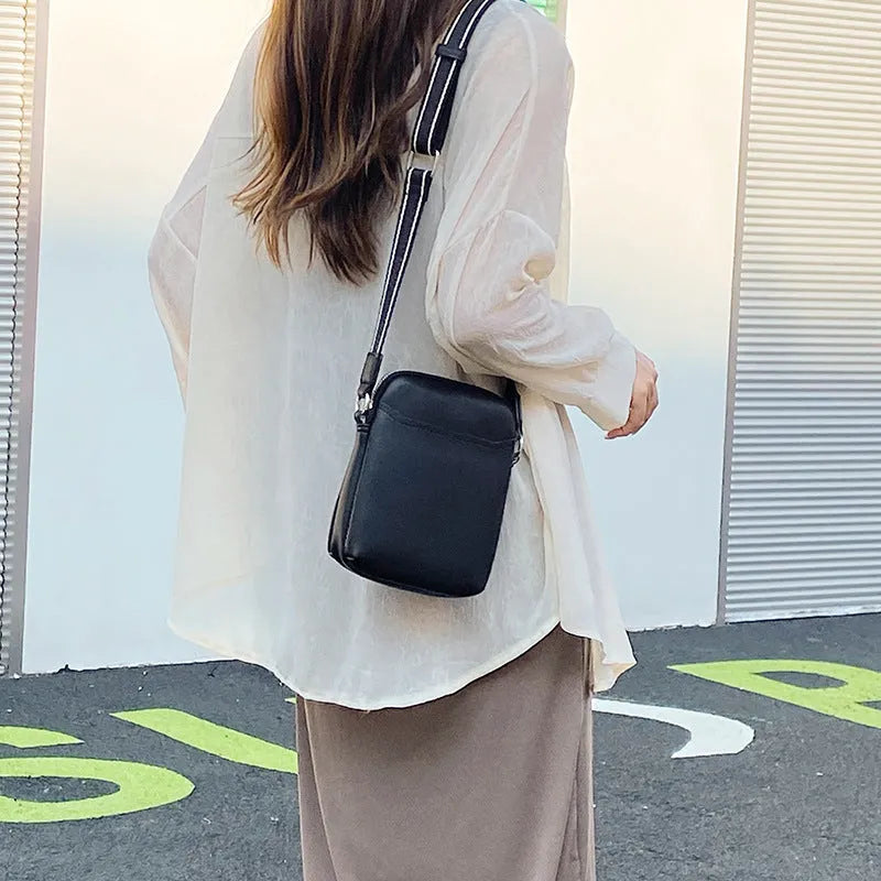 Small solid colour PU leather crossbody shoulder bag for mobile phone in beige.