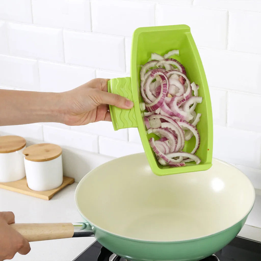 Green multi-function cutting board with draining holes mounted on kitchen sink for vegetable preparation