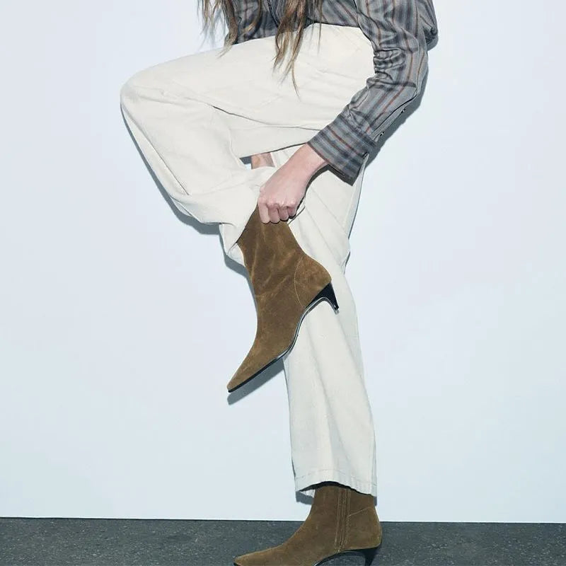 Brown square toe ankle boot with side zipper and a low kitten heel on a waterproof platform sole.