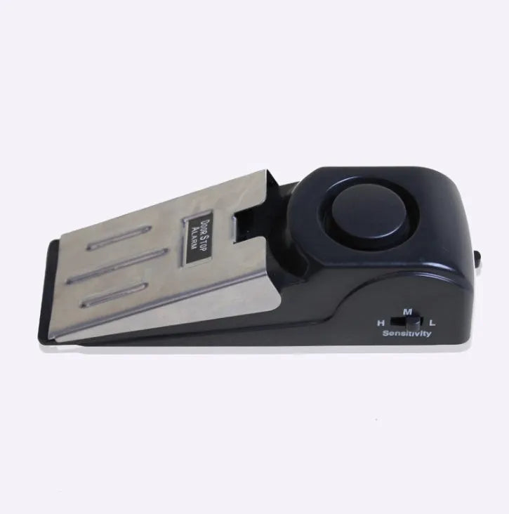 Portable wedge-shaped door stop alarm with stainless steel cover and 120 dB siren for home and travel security