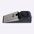 Portable wedge-shaped door stop alarm with stainless steel cover and 120 dB siren for home and travel security
