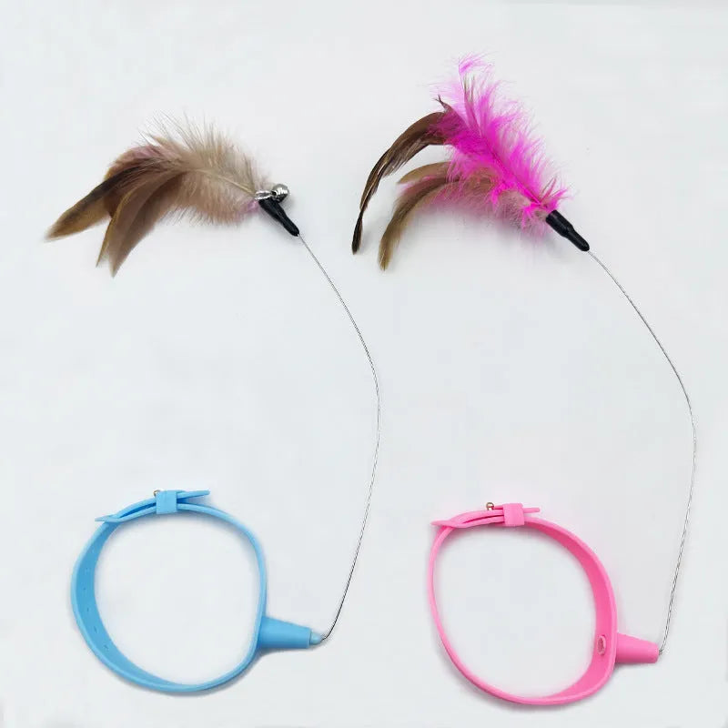 Adjustable cat toy collar with feather bell attachment in pink or blue colour for cats with 17-27cm neck circumference