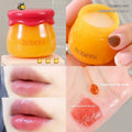 Vaseline moisturising lip balm pot in 9g size with a small brush applicator.