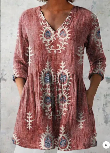 Women's loose-fitting long dress with a blue wave pattern print and 3/4 sleeves.