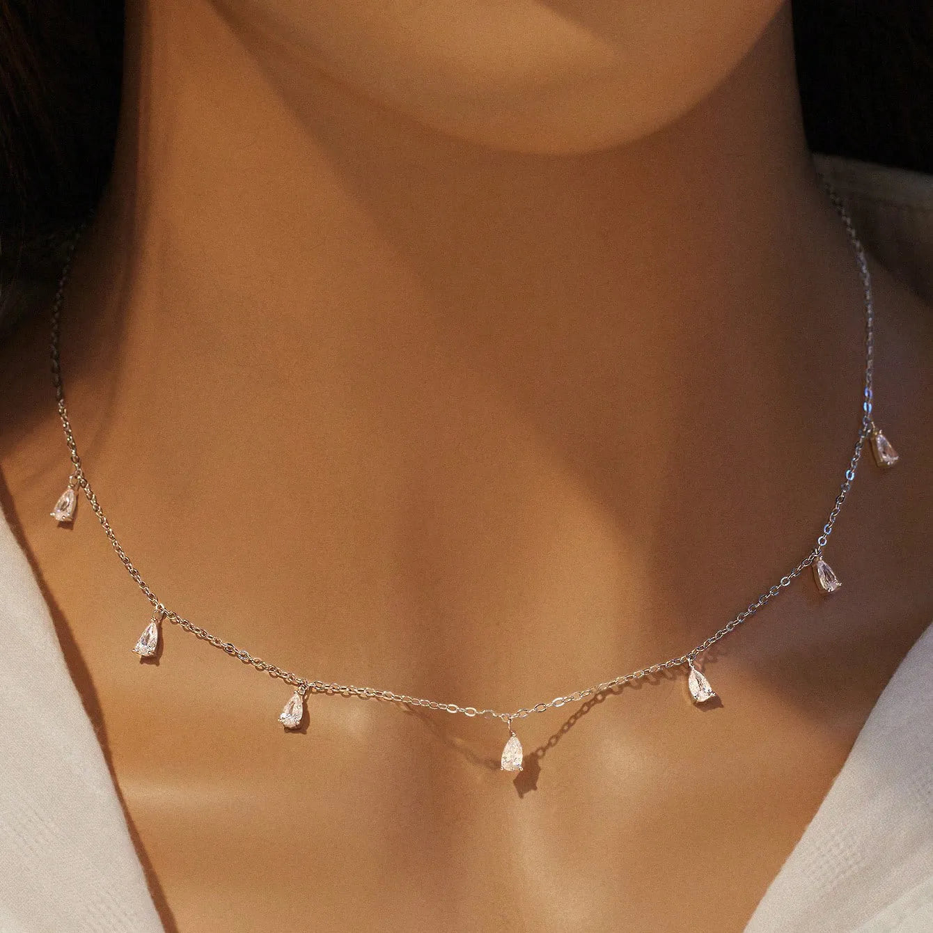 Women's 925 silver drop-shaped artificial zircon necklace on an O-chain, showing silver, rose gold, and golden yellow colour options.