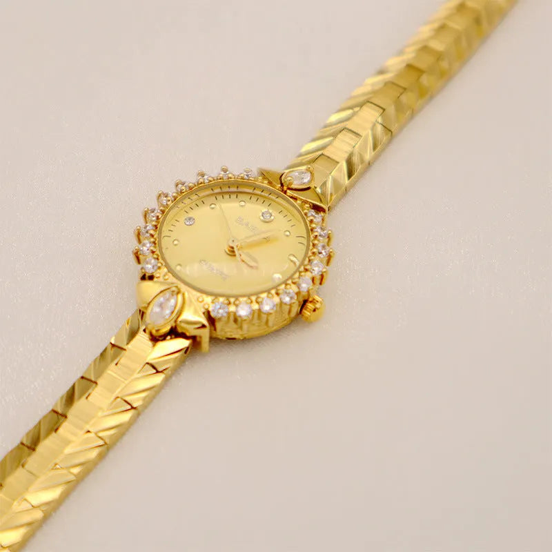 Gold quartz bracelet watch for women with 6mm thickness and embossed vintage detailing