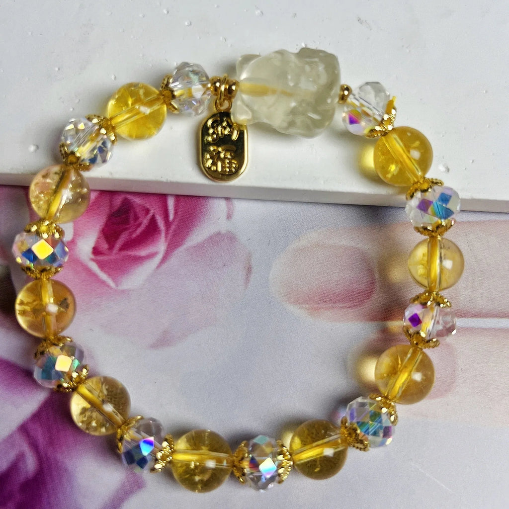 Handmade adjustable bracelet with a natural citrine nine-tail fox charm on a silver-tone chain.