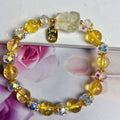 Handmade adjustable bracelet with a natural citrine nine-tail fox charm on a silver-tone chain.