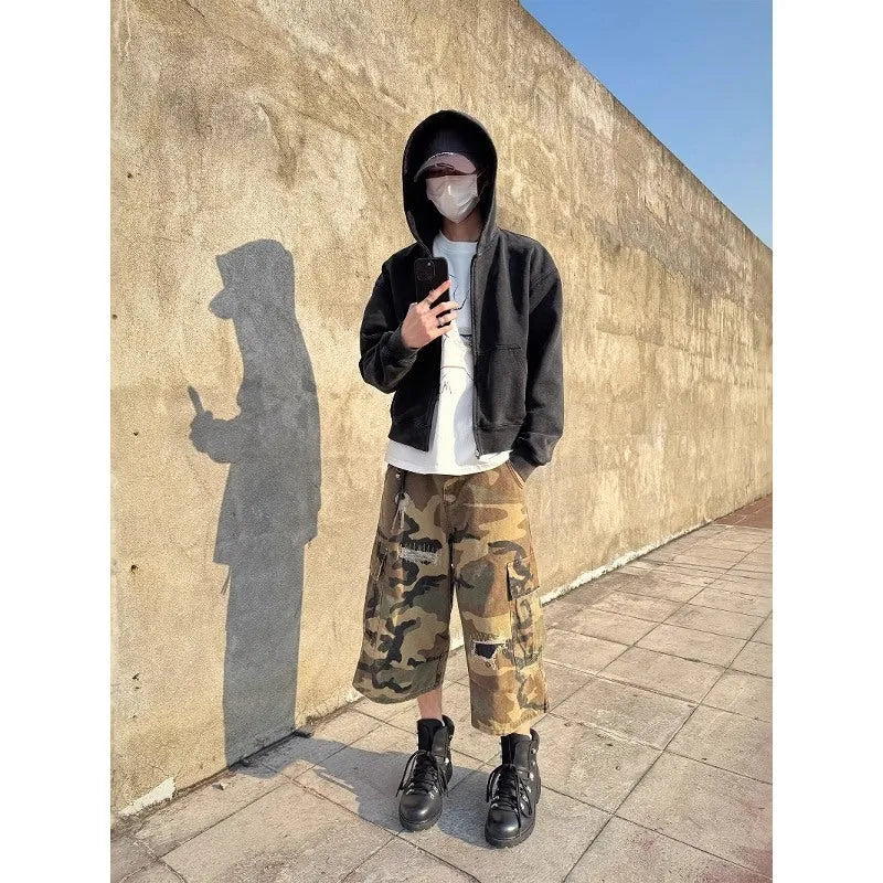 Men's loose-fit camouflage cropped jeans with ripped patches and straight leg