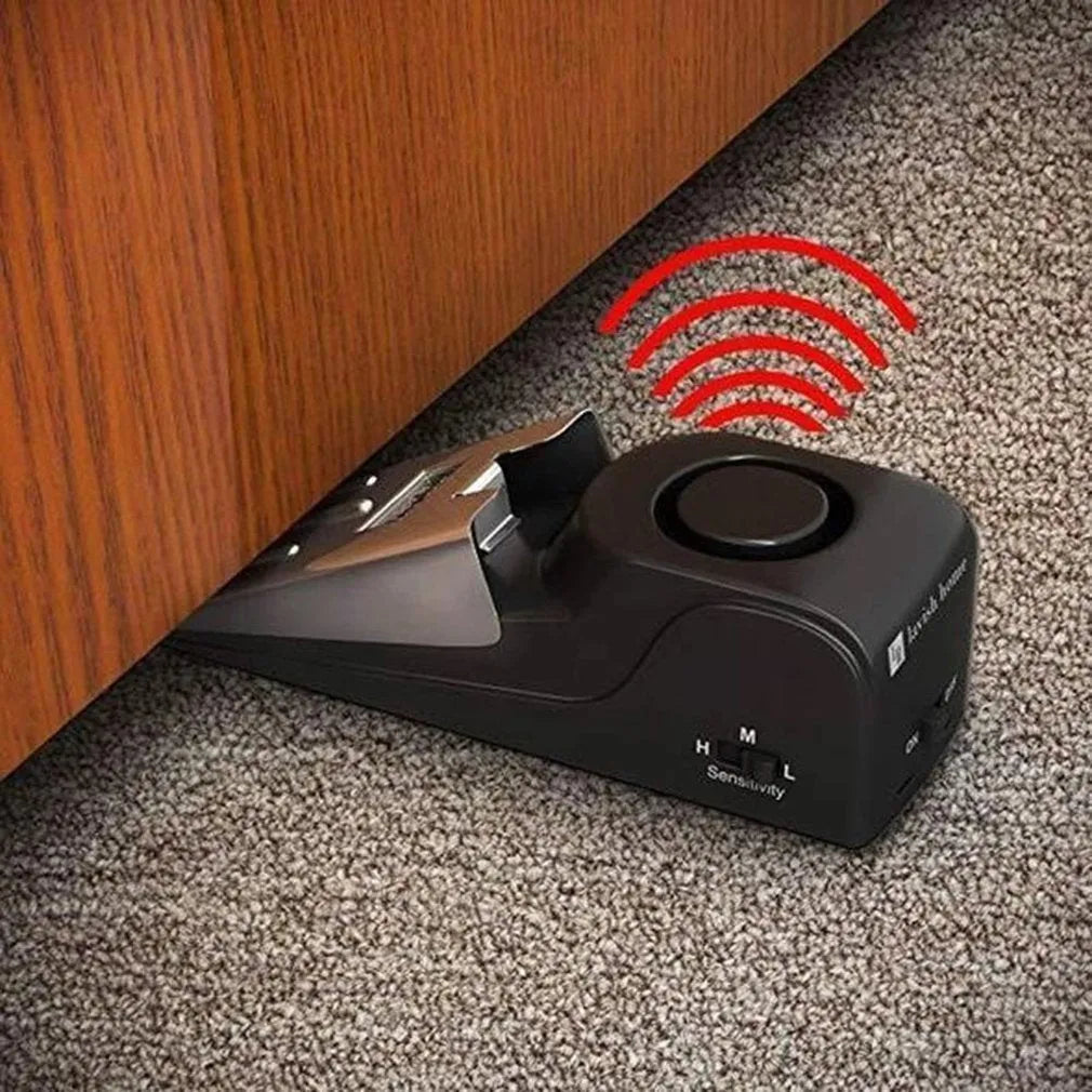 Portable wedge-shaped door stop alarm with stainless steel cover and 120 dB siren for home and travel security