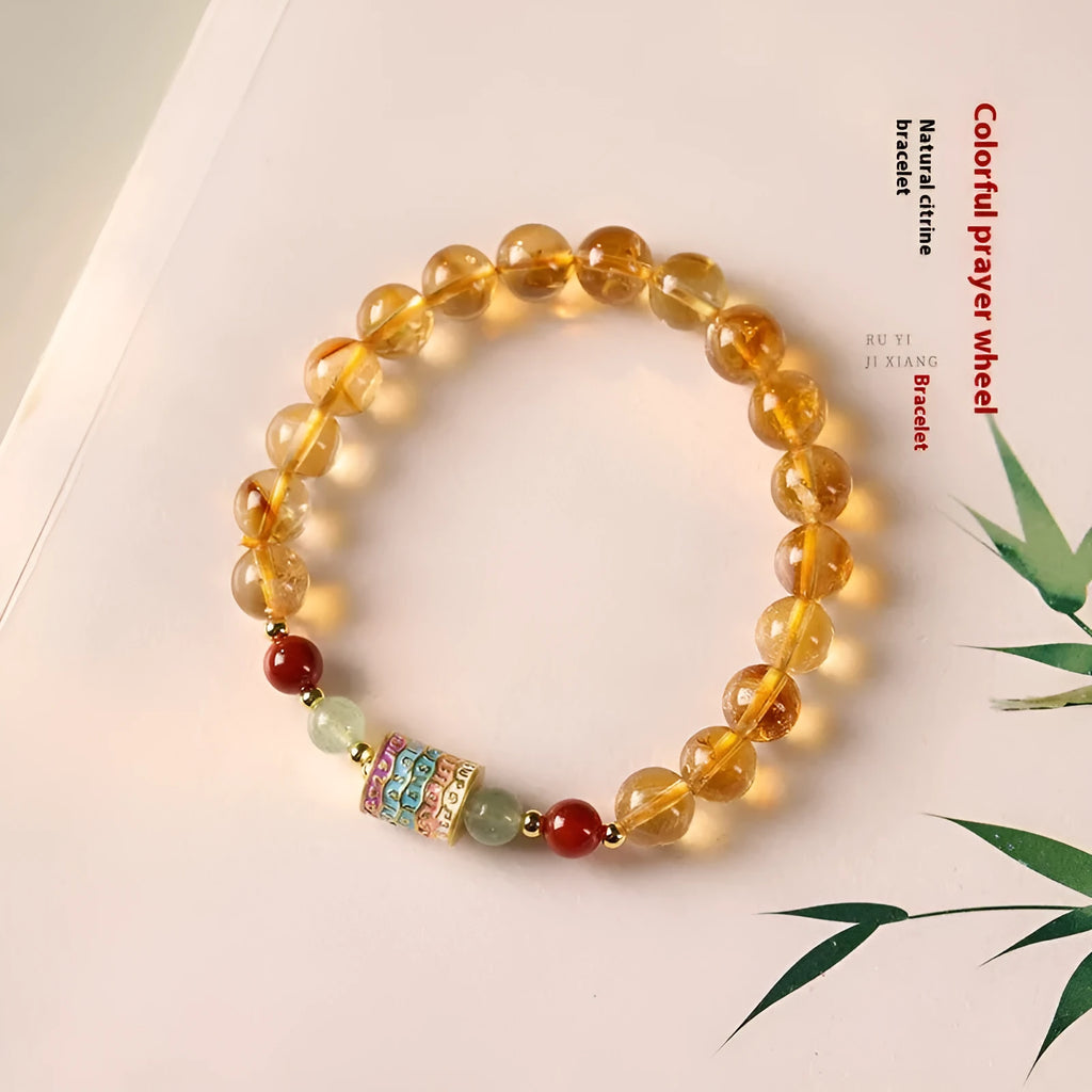 Yellow citrine bracelet with prayer wheel charms and 8mm round beads
