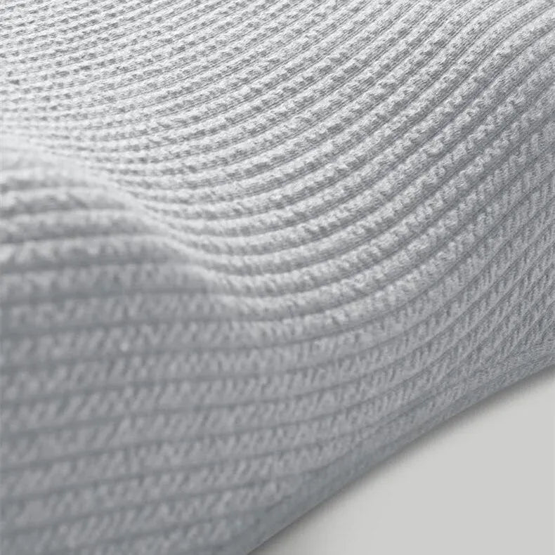 Grey memory foam neck support pillow with knitted cotton cover and adjustable loft for pain relief