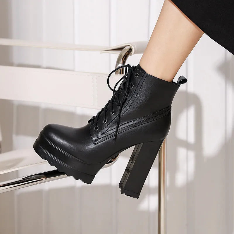 Women's black waterproof platform boots with chunky heel, cowhide upper, and side zip closure