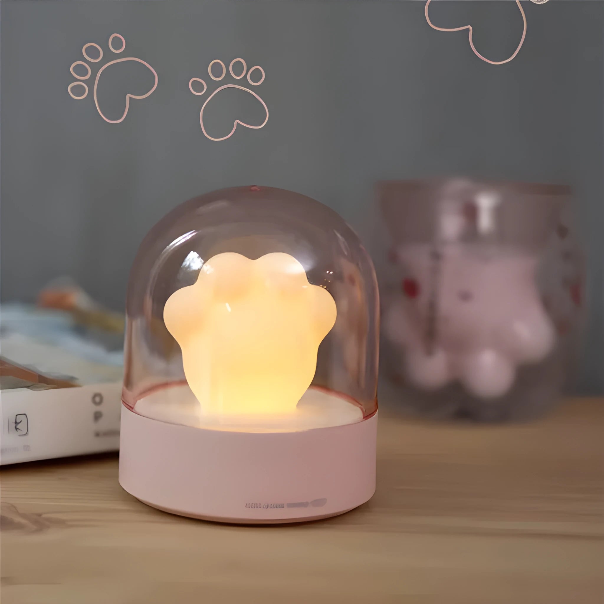 Grey cat paw USB charging music box night light with adjustable brightness on wooden desk