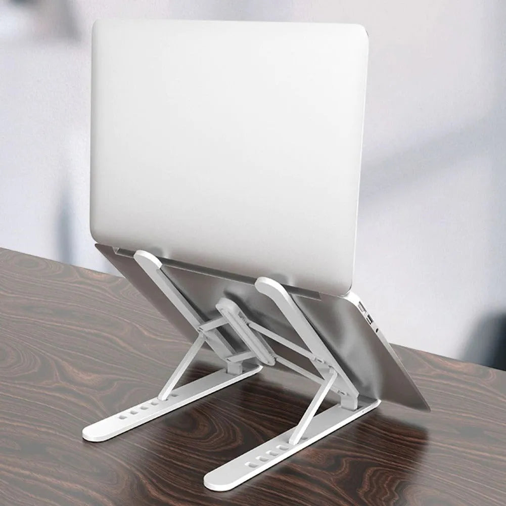 Black ABS adjustable laptop stand with 6 height gears folded flat on a white background
