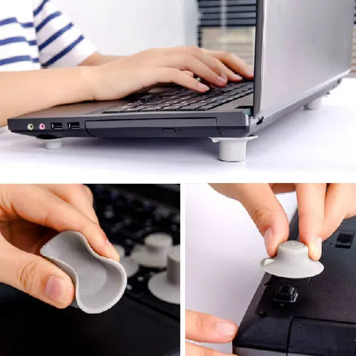 Set of four grey plastic laptop cooling pads, two large and two small, on a desk.