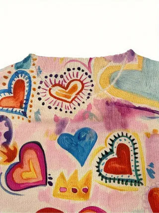 Loose fit digital printed top with lapel collar on a hanger, showing a graphic design.