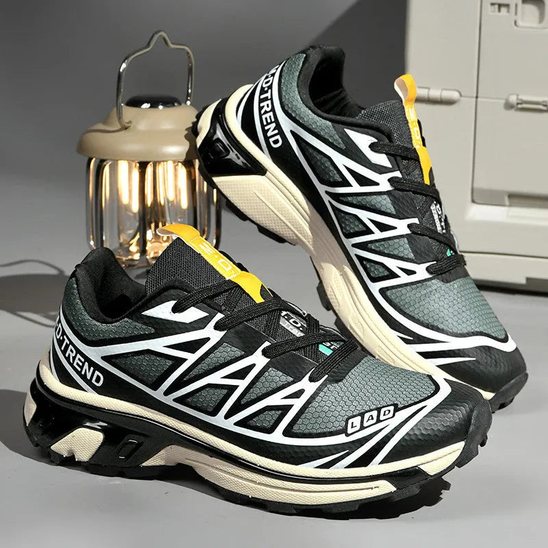 Low-top lace-up hiking shoe in khaki with a rubber sole and mesh lining detail.