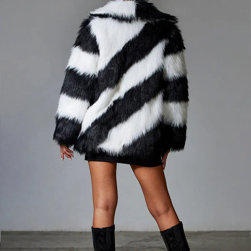 A minimalist faux fur coat with contrast lapels and a detachable fur collar, shown in picture colour.