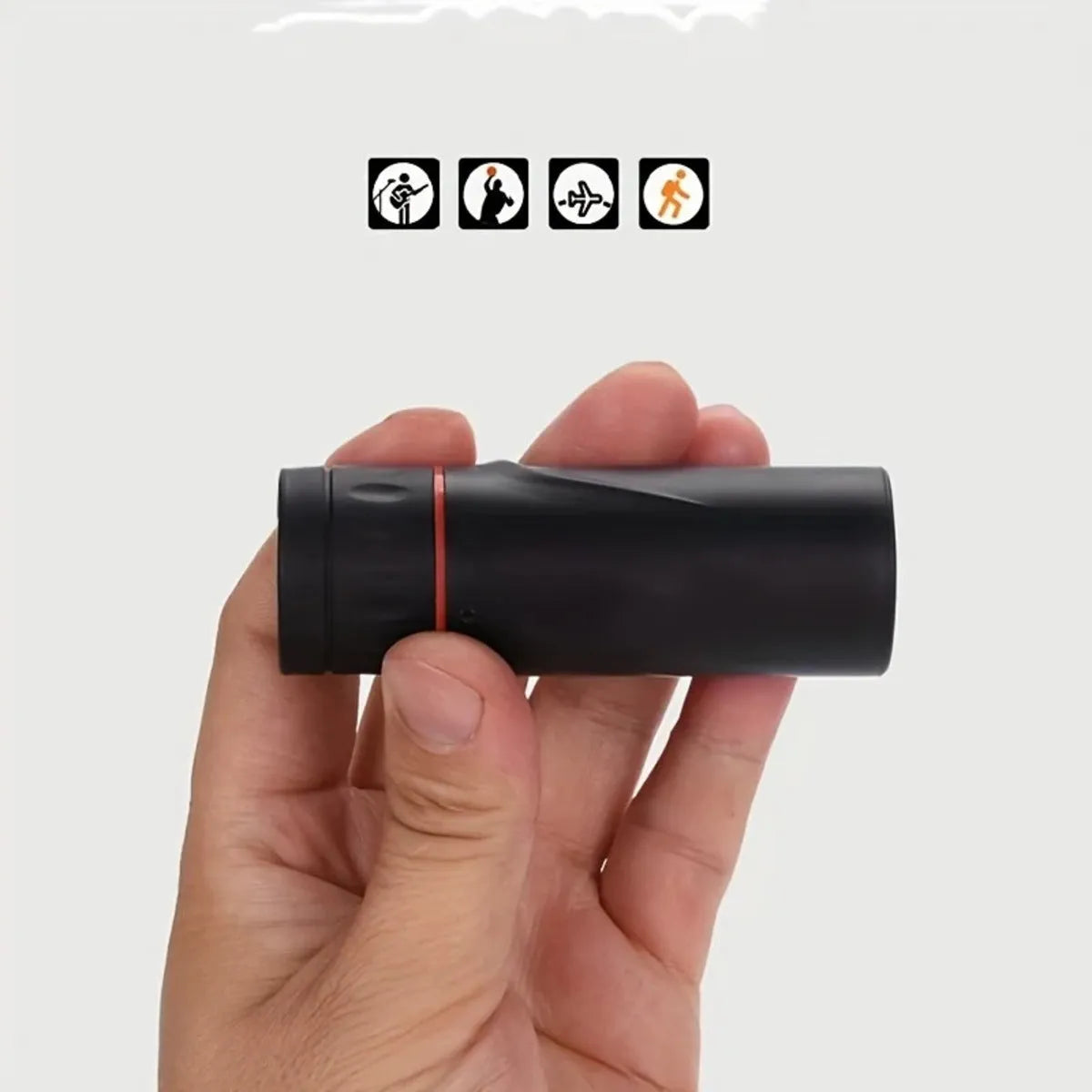 Black monocular telescope with mobile phone holder attached for outdoor observation