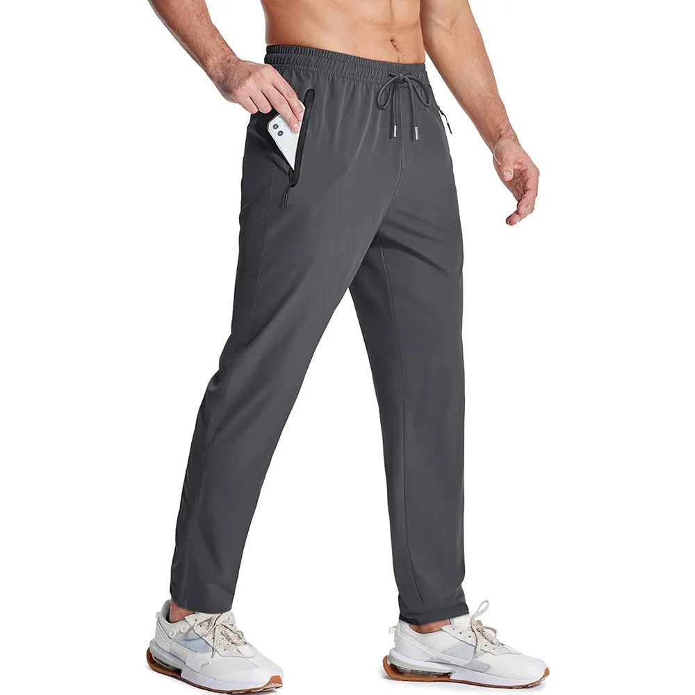 Men's loose lace-up elastic waist casual pants in polyester, available in multiple colours including black and blue
