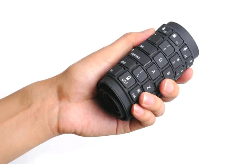 Black foldable silicone Bluetooth keyboard with 108 keys, unfolded, showing full key layout